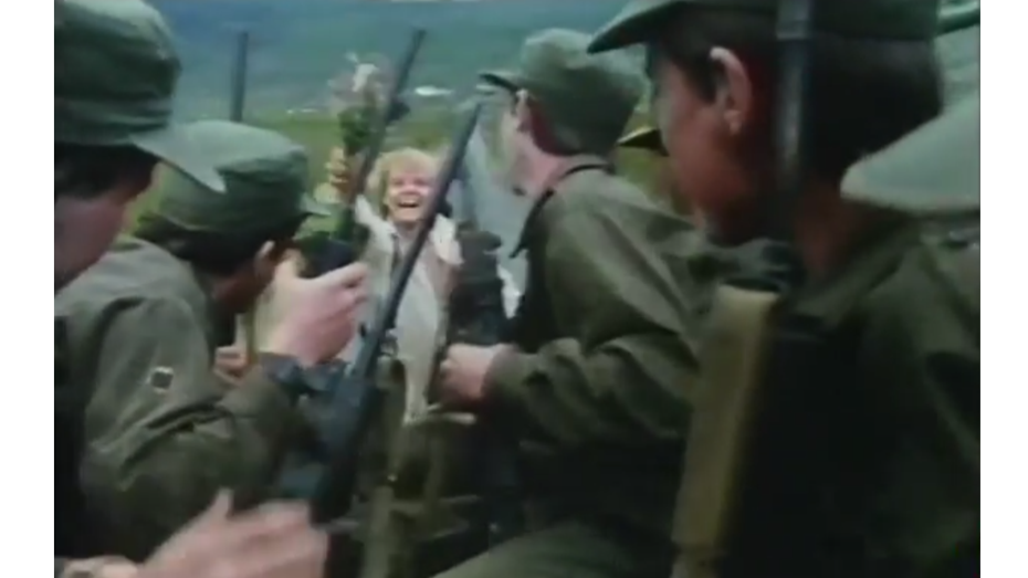 Pichirica chasing the soldiers' truck with a bouquet of flowers.